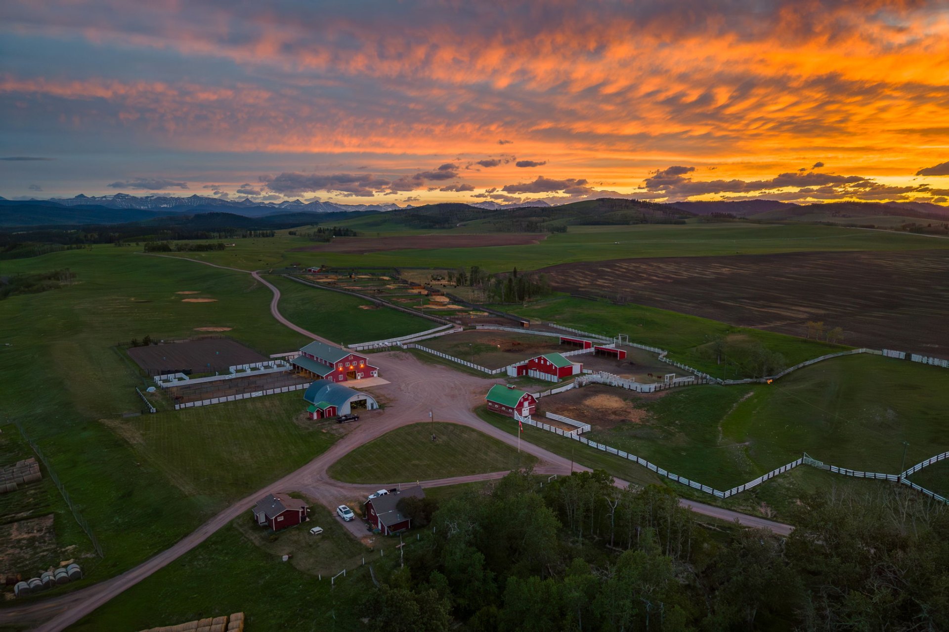 Legacy Sky Ranch at twilight with Rocky Mountains and Sheep River